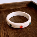 Detailed macro view of vintage resin bangle featuring marble textures and colorful gemstones - Cream Marble Resin Bangle With Stones (19#)