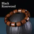 Authentic black rosewood barrel bead bracelet with natural wood grain on ceramic pot - Black Rosewood / Large Barrel Beads