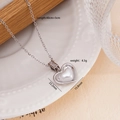 Collana a cuore argento con perla bianca e dettagli in zircone su piatto ceramico - Argento Perla Cuore