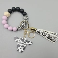 Pink and cow print silicone bead keychain wristlet with Mama cow head charm and tassel - Taro Purple