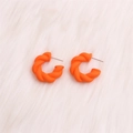 Exaggerated orange twisted C-shape hoop earrings with a matte finish acrylic texture - Small Orange Twisted