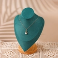 Golden necklace with swan pendant and pearl on a dark green velvet bust display - Medium / Dark Green