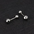 Detailed macro shot of 16g stainless steel barbell studs with faceted silver ends - Round Ball-5mm / Steel