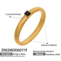 Gold stainless steel bracelet with black gemstone and dimensions 6.0cm inner diameter - Wide Black Zirconia Style (Z002)