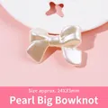 Detail of a 24x33mm faux pearl resin bow bead accessory with soft pearlescent luster - 03-Pearl Large Tie-24X33mm