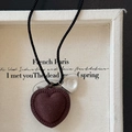 Braided rope necklace with dark brown heart pendant and silver metal charm - Brown Heart Bag Necklace