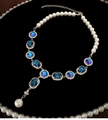 Elegante collana vintage con gemme blu ovali e perle bianche su catena d'argento - Collana con Nappine di Perle Ovali Blu