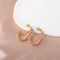 Twisted gold-plated hoop earrings with pink enamel finish on elegant silk background - Gold (E00288-18)