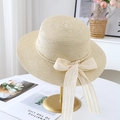 Close-up of an elegant flat top straw hat with a lace bow and pearl trim decoration - M (56-58cm) / JS80461-9 Beige 2
