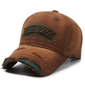 Distressed vintage brown baseball cap with green embroidery in a 45-degree profile view - Coffee