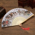 Detail of Chinese folding fan with Jiangnan water town landscape and red tassel - Water Town