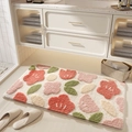 Absorbent floral bath mat with pink flowers and green leaves on white background - Floral Fragrance