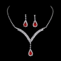 Sparkling bridal jewelry set featuring red teardrop rhinestones on necklace and earrings - Red