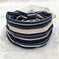 Macro detail of bohemian striped elastic headband fabric with navy and purple patterns - 91