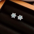 Macro shot of silver snowflake earrings with a light blue gemstone in a black jewelry box - Silver Snowflake Light Blue Gemstone Studs (27# Silver Pin-Silver-Blue)