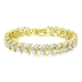 Detailed macro view of gold marquise-cut white zircon bracelet with luxury fold-over clasp - 14K Gold + White Stone