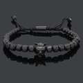 Detail of beaded wolf head bracelet with green crystal eyes and adjustable cord - Black Wolf Head