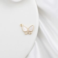 Macro shot of 18k gold butterfly pendant with mother of pearl and zircon details - Zircon Butterfly 18mm