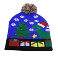 Detail view of the colorful LED power switch on a blue knitted dinosaur Christmas hat - One Size / Blue Dinosaur (LED)