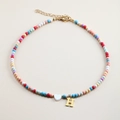 Colorful beaded necklace with a white heart charm and gold H-letter pendant close-up - Letter H