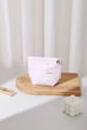 Close-up of pink makeup bag with bow embroidery and decorative flower zipper pull charm - Pink Velvet Bow (Small)
