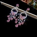Detail showing pink butterfly earrings with teardrop zirconia charms on a dark background - Ear Clip (Silver-Pink)