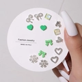 Close-up of 9-pair assorted stud earring set featuring silver stars and green hearts - 9 Pairs Set / E0598-1 (Silver Green Heart Bow Set)