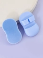 Macro detail of soft blue silicone facial brushes with ergonomic finger loop handles - Finger Cleansing Brush / Blue