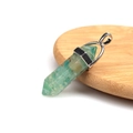 Green crystal hexagonal column pendant with silver metal bail on a wooden base - Resin Green Aventurine