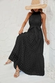 Detail of black halter maxi dress showing the layered tiered skirt and grid texture fabric - Black
