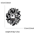 Retro-Brosche aus Glas mit schwarzen und weißen Strasssteinen und Größenangaben - Gunmetal