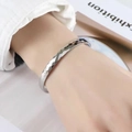 Faceted silver open bangle in titanium steel featuring a minimalist geometric design - 6mm Width / Silver