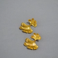 Detailed view of gold leaf earrings with irregular textures and 925 silver pins - Gold Plating