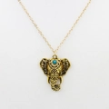Golden elephant pendant necklace with turquoise stone inlay on a thin chain - Hollow Elephant Pendant / Antique Gold