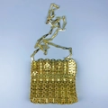 Detailed view of golden sequin chainmail texture and metallic shoulder strap on fashion bag - Gold