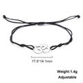 Detail eines verstellbaren schwarzen Kordelarmbands mit Edelstahl-Om-Symbol-Anhänger - Verstellbares geflochtenes Seil / Schwarze Kordel Silber