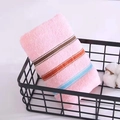 Pink striped cotton face towel with colorful accents folded in a metal storage basket - Weak Twist Dotted Satin Pink / 34*74cm