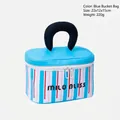 Blue and white striped portable makeup bag with black top handle and MILO BLISS logo - Blue Striped Bucket Bag