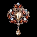 Detail view of vintage brooch with champagne waterdrop crystal and intricate rhinestones - Brown