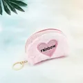 Close-up of pink plush heart coin purse with rainbow embroidery and gold keychain - Semi-circle Tie-dye Pinkish