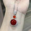 Detailed close-up of a silver necklace with round red chalcedony pendants on a wrist - Red Chalcedony Pendant Only (Without Chain)