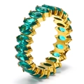 Detail view of oval emerald-green stones set in a gold-plated stainless steel ring band - Gold + Aqua Green Zirconia