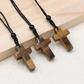 Three pieces of natural tiger eye stone cross necklaces on woven black cords - Tiger's Eye