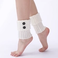 White knitted leg warmers with cable stitch pattern and decorative black buttons - One Size / White