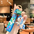 Portachiavi con unicorno bianco con cinturino in silicone blu e anello dorato - Blu