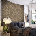 Detailed texture of the vintage gold and brown mandala tapestry hanging in a bedroom - Golden Brown Mandala