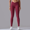 Detail of burgundy seamless yoga leggings with a crossover high waistband for women - S / Burgundy