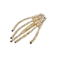 Goldene Skeletthand-Haarklammer mit glitzernden Strasssteinen und schwarzen Details - Gold mit schwarzen Nägeln