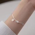 Silver chain bracelet with ancient coin charms and pavé cylinder bead on wrist - Waist Bead Copper Coin Bracelet