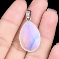 Flat teardrop natural lavender opal stone pendant with silver metal bail on black background - Opalite (Synthetic) (1pc)